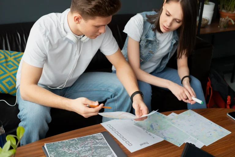 close-up-people-planning-trip-together